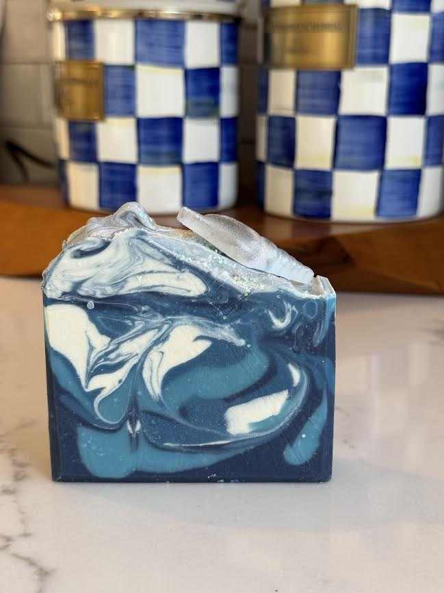 Custom wedding shower favor soap with spearmint eucalyptus scent, featuring blue and white swirls, shell accent, biodegradable glitter, and mica.