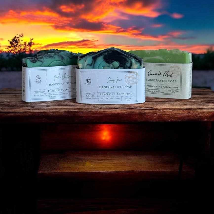 MENS ULTIMATE SOAP BUNDLE displayed outdoors at sunset with three handcrafted soap bars: Stormy Seas, Azure, and Emerald Mist.