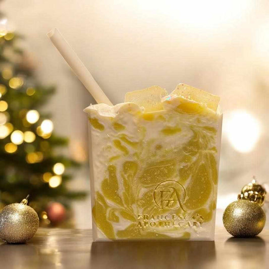 Lemon Drop Soap with citrus and mint scent, topped with biodegradable glitter, displayed against festive decor.