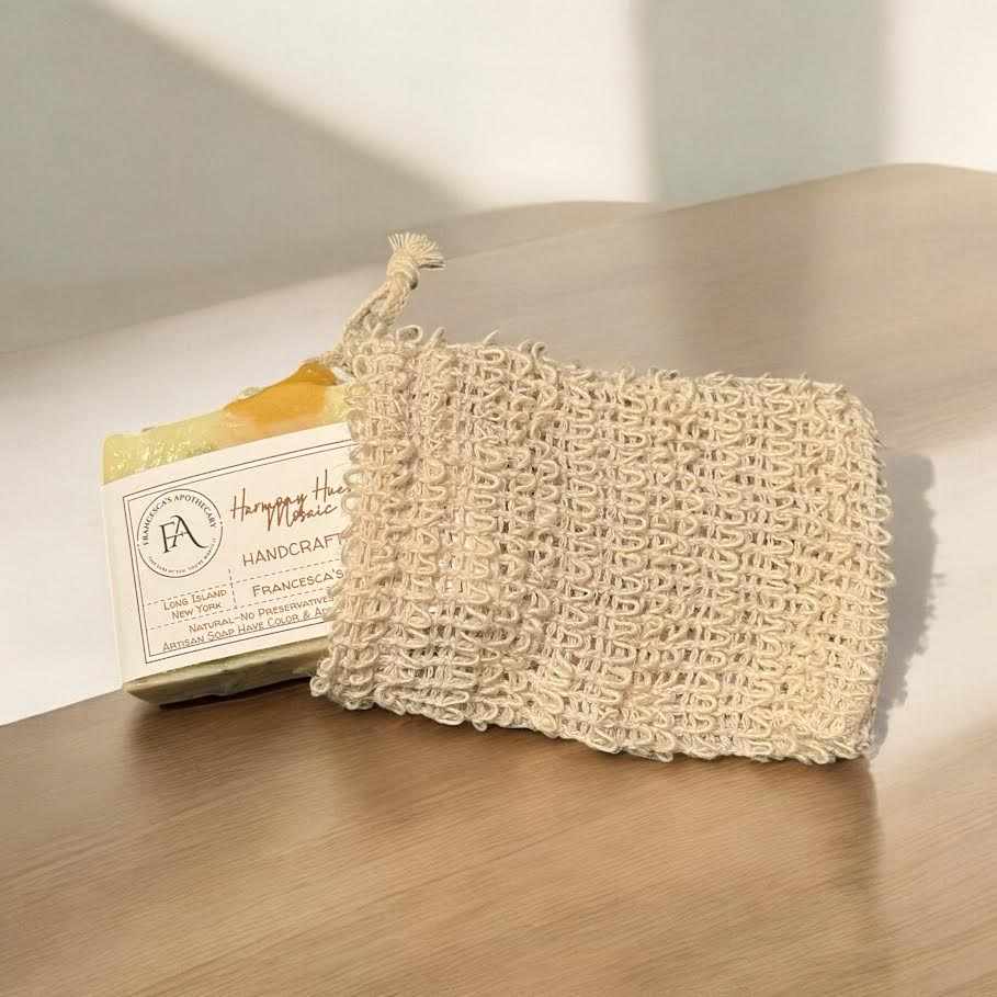 Harmony Hues Mosaic Soap with complimentary soap saver bag on a wooden surface.
