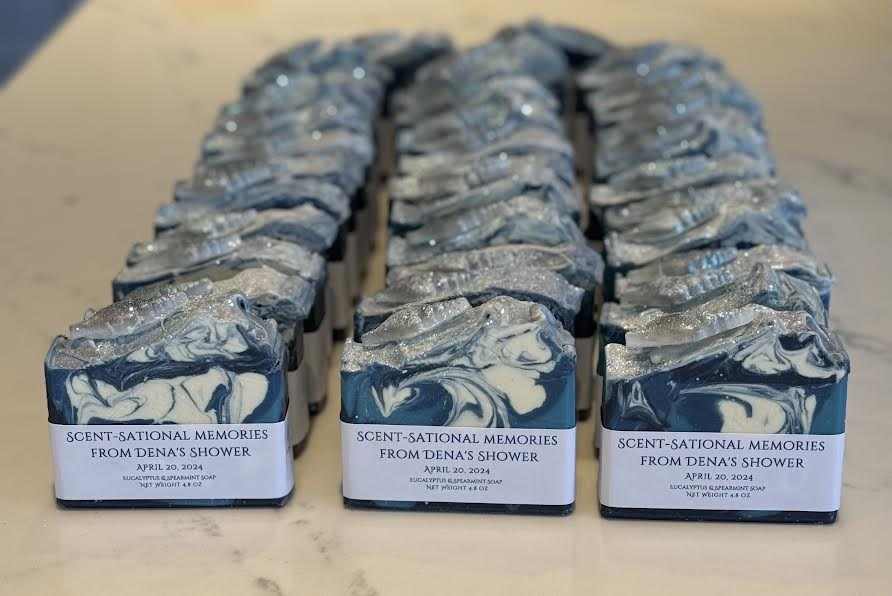 Custom wedding shower favor soap with spearmint and eucalyptus fragrance, featuring blue and white swirls, shell design, and personalized label.