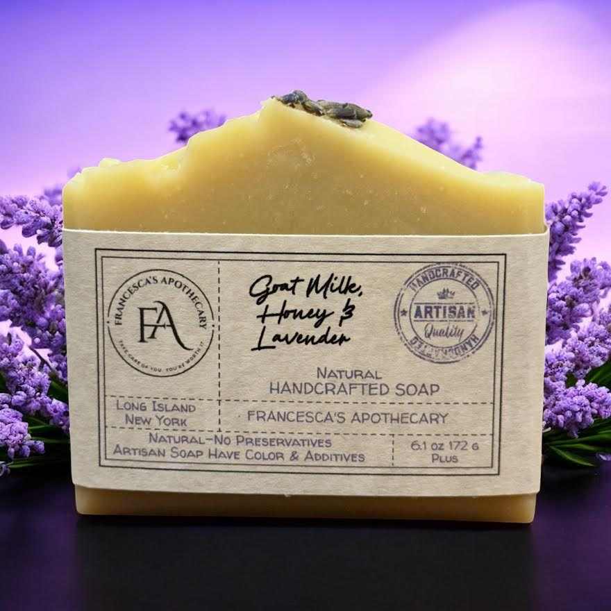 Large goat milk and honey lavender soap bar with natural handcrafted ingredients and light lavender scent on purple lavender background