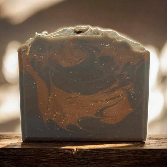 Large amber ash artisan soap bar with warm sandalwood and creamy vanilla scent, handcrafted with organic oils and activated charcoal