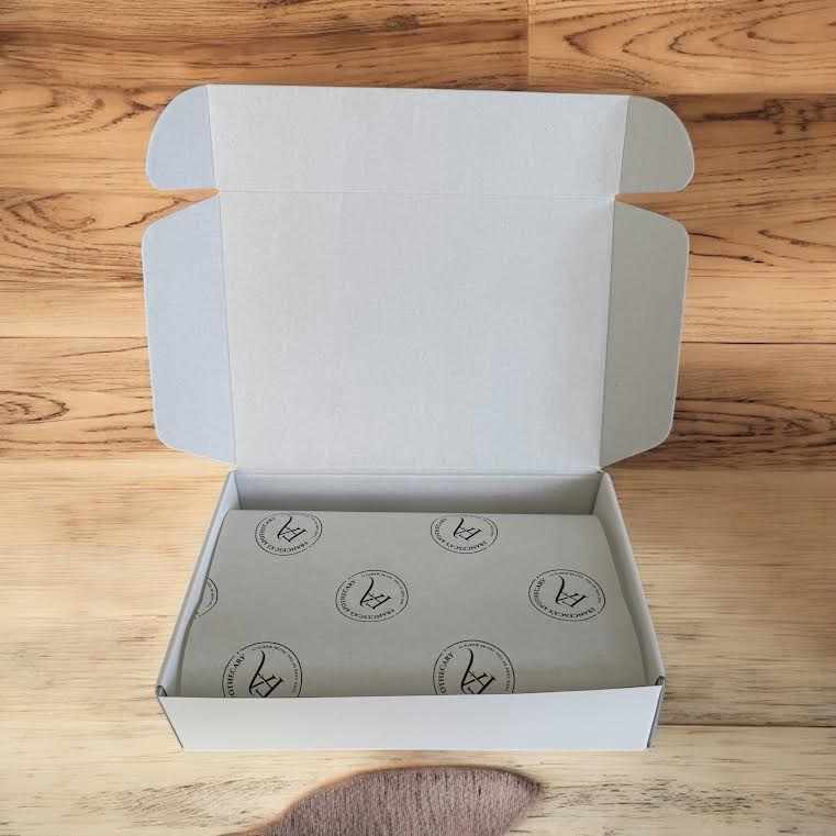 Luxurious white gift box with brand logo, featuring Mens Ultimate Soap collection wrapped in signature tissue paper.
