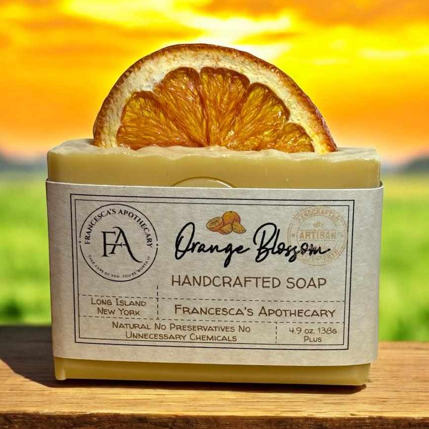 Handcrafted Orange Blossom soap with dehydrated orange slice, featuring natural ingredients for a refreshing experience.