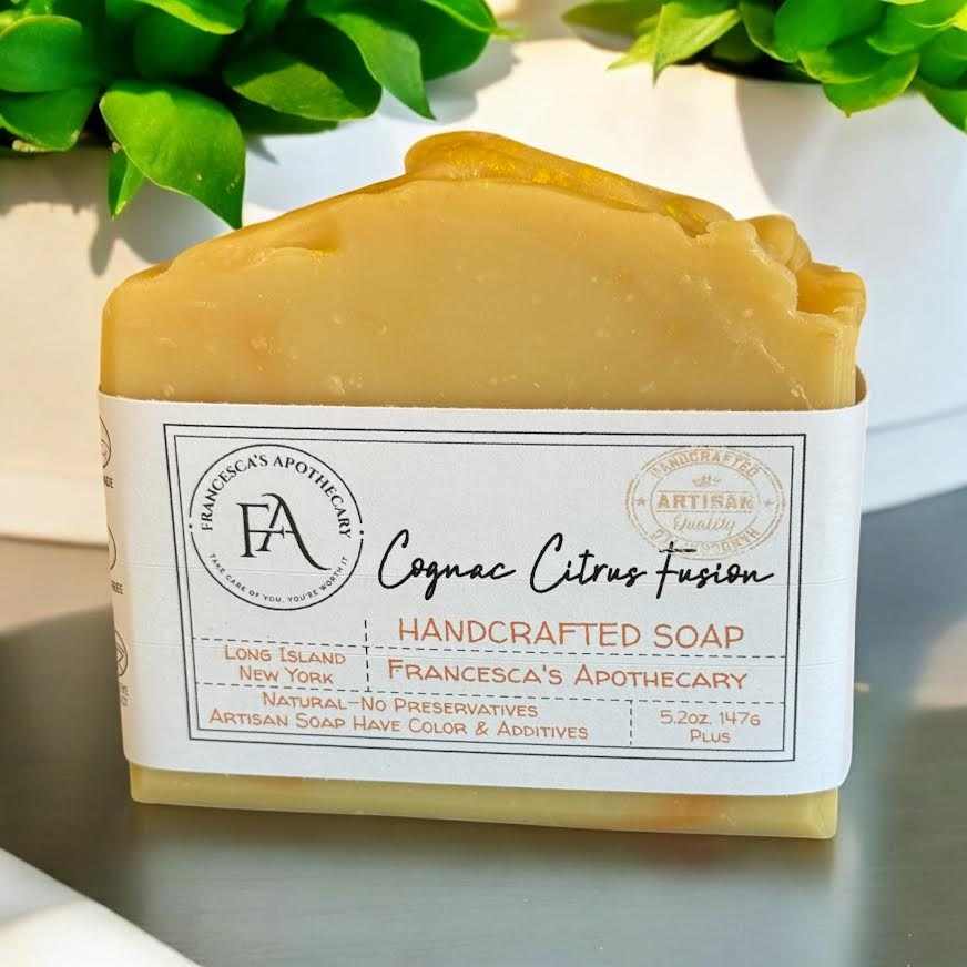 Cognac Citrus Fusion Soap with handcrafted label, featuring aromatic notes of almond, cocoa, orange flower, lime, benzoin, and cognac.