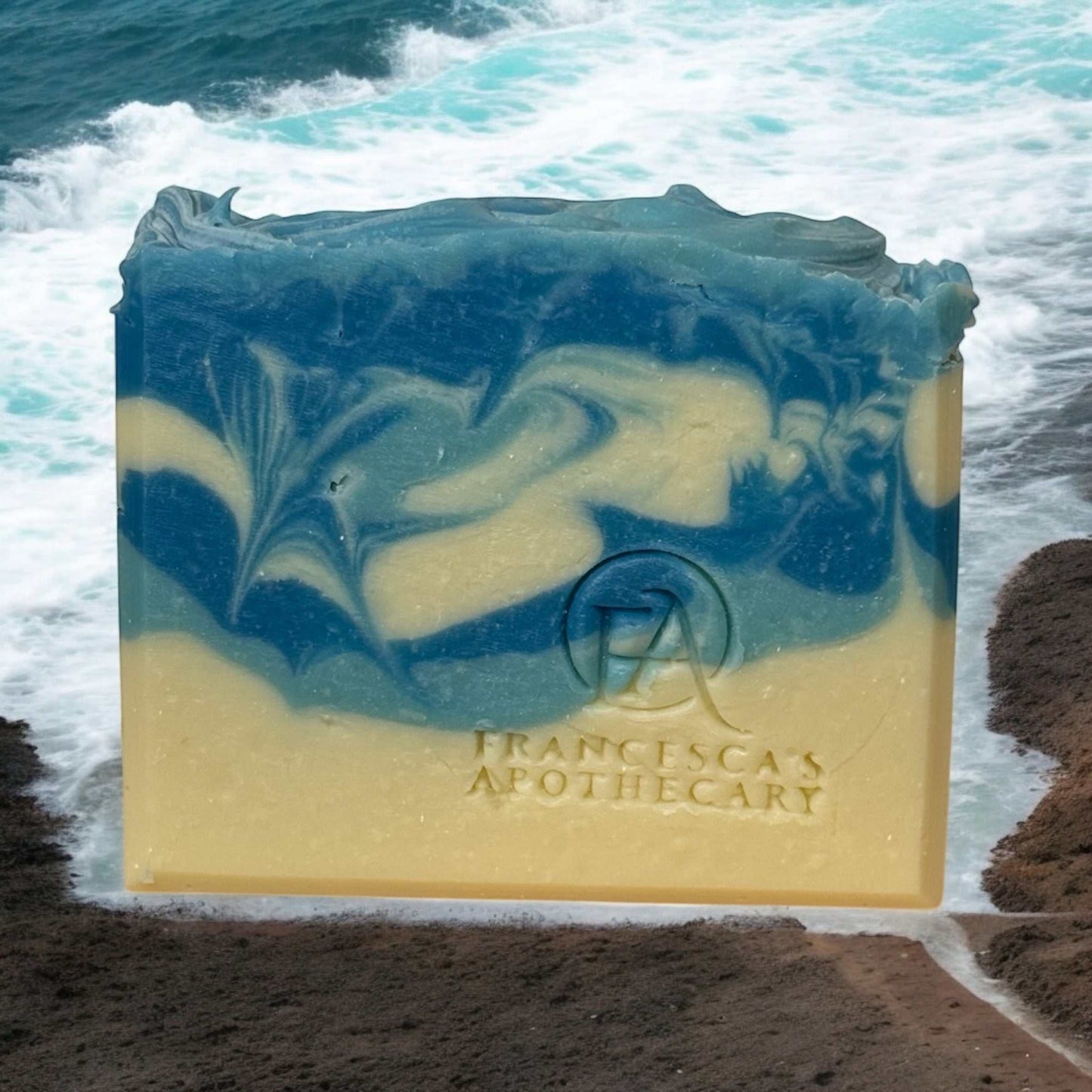 Men's soap bundle featuring a vibrant blue and cream swirled soap bar by the ocean.