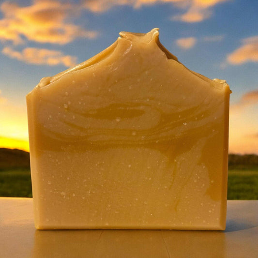 Sweet Sugar Lemon Soap against a vibrant sunset sky.