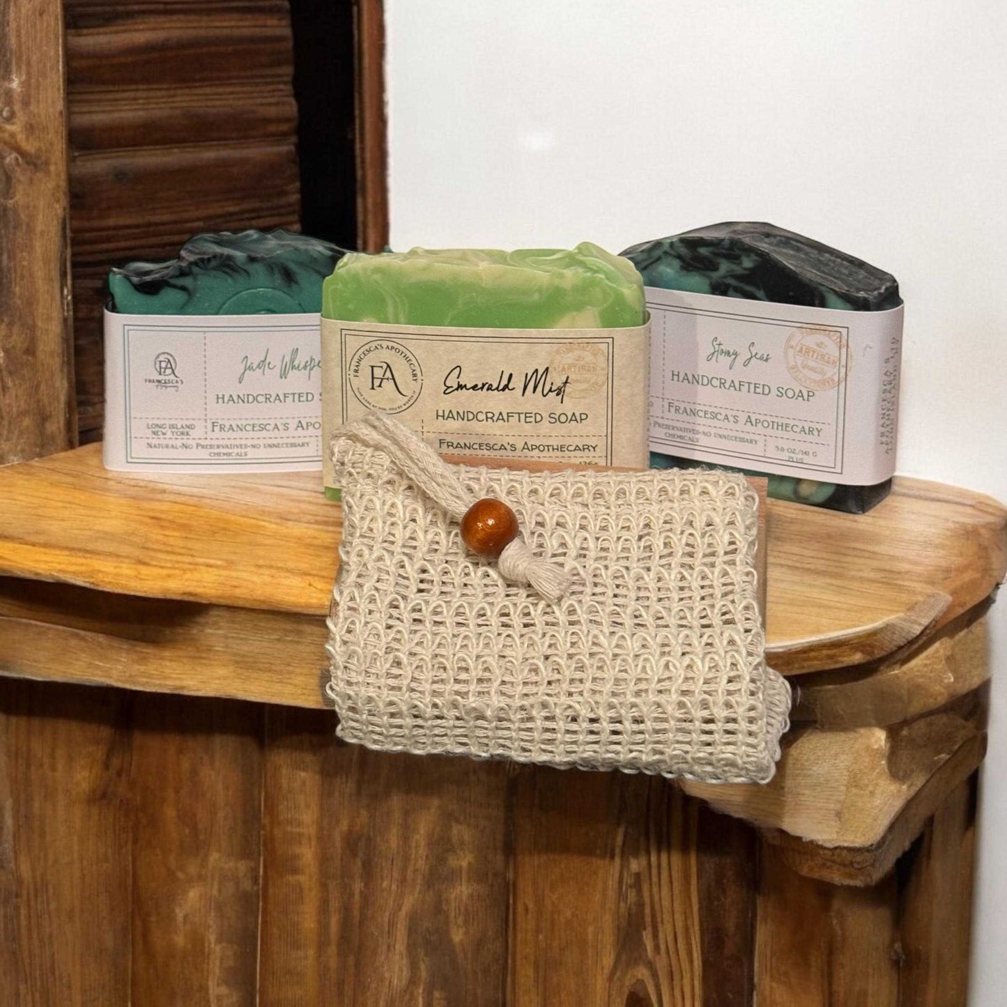 MENS SOAP LUX BOX featuring handcrafted Emerald Mist, Jade Whisper, and Stormy Seas soaps displayed on a wooden surface.