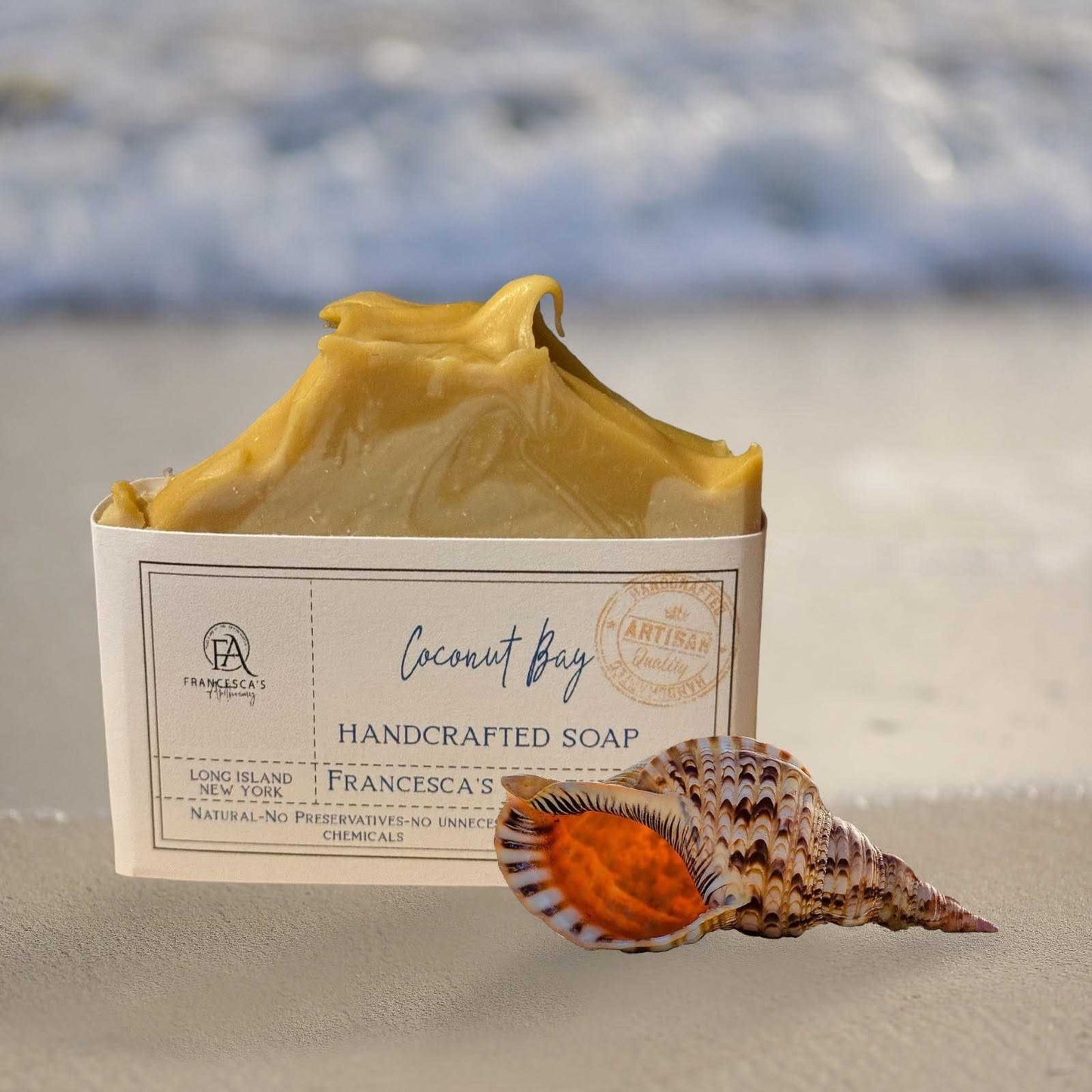 Coconut Bay Soap with seashell, featuring fresh coconut aroma, handcrafted with organic oils and butters.