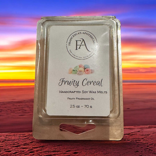 Fruity Cereal soy wax melt package with handcrafted soy wax and fruity fragrance oil against a colorful sunset background